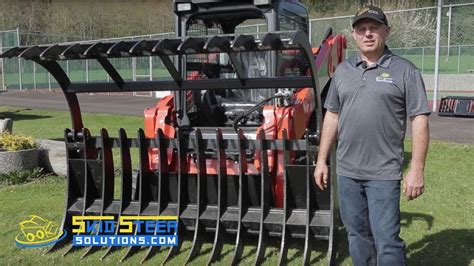 grapple falls off skid steer loading tree on trailer|grapple jaw not holding in position.